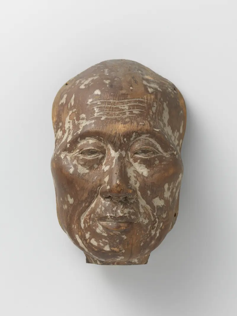 Wood sculpture of a priest's head by Unknown Artist