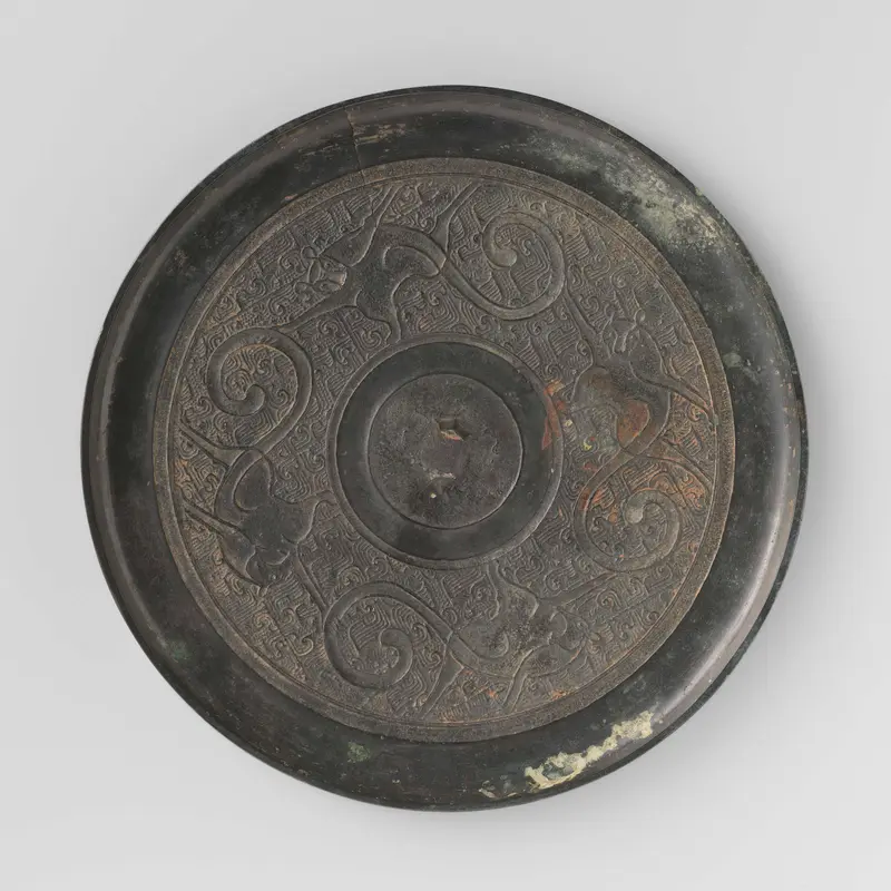 Bronze mirror with four monkeys by Unknown Artist
