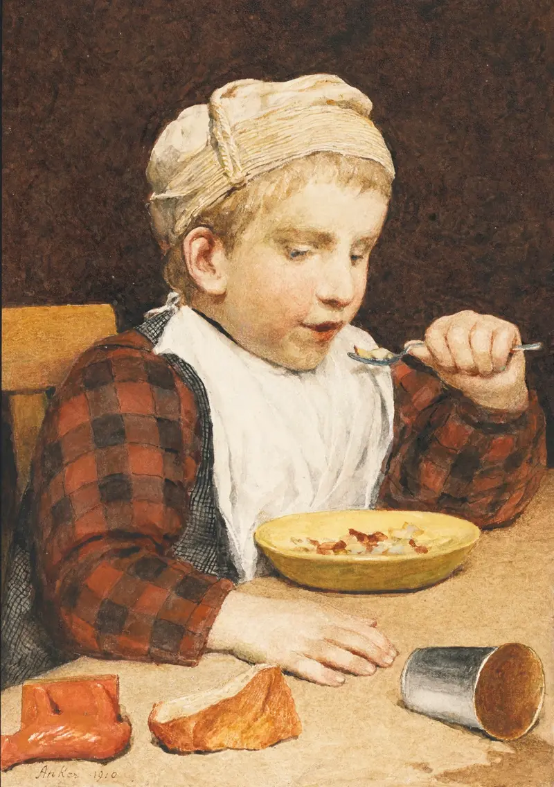 A young boy wearing a cap is depicted eating in this charming genre scene by Albert Anker.