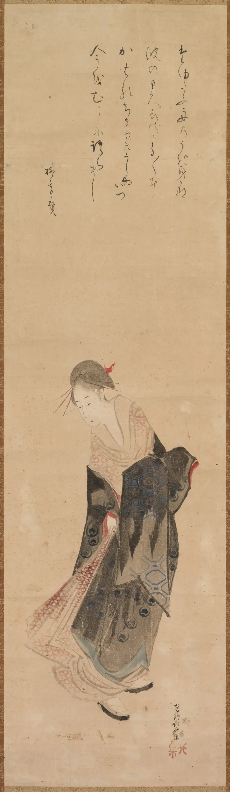 A beautiful woman in traditional attire, captured in a moment of quiet grace.