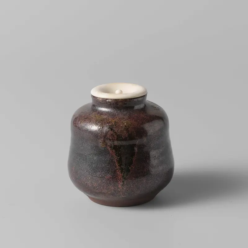 Tea caddy with a purple glaze by Unknown Artist, showcasing vibrant ceramic craftsmanship.