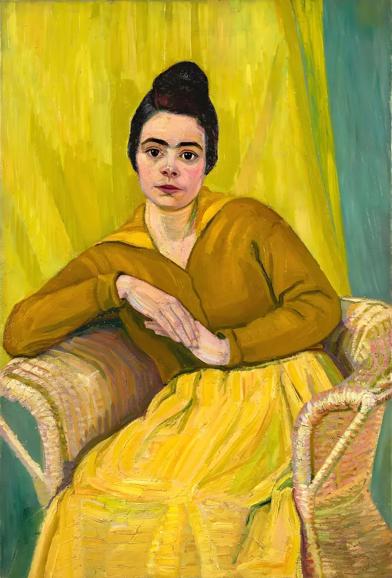 A seated lady in a wicker chair, showcasing the elegance of early 20th-century design.