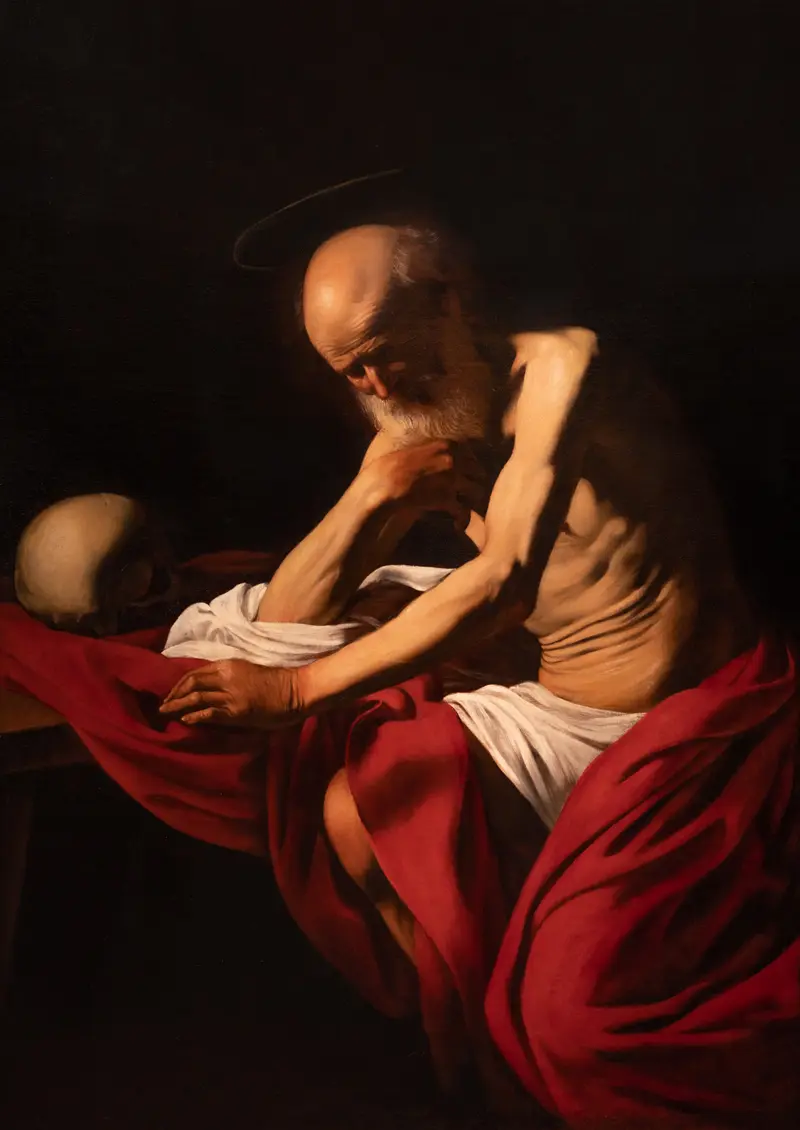 Saint Jerome kneeling in penitence, with a rock and skull, draped in a red cloak.