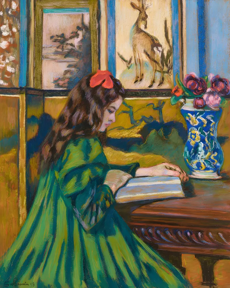 A portrait of Madeleine Guillaumin reading by Armand Guillaumin.