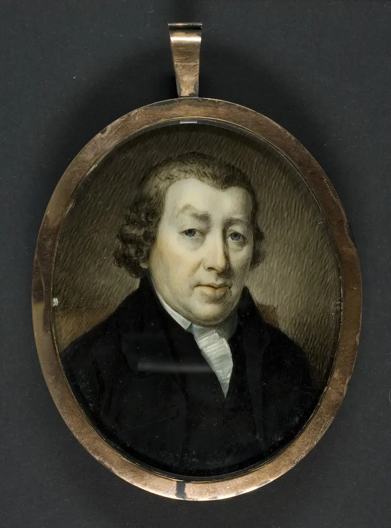 Portrait of a gentleman in ivory by English, featuring rich fabrics and elegant attire.