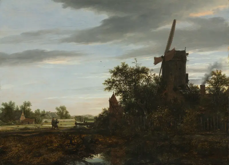 A tall windmill rises above trees on the right with sails catching light, a narrow watercourse reflects vegetation and sky in the foreground.
