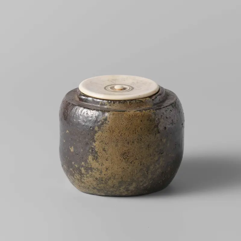Tea caddy with a green brown glaze, ceramic medium by unknown artist