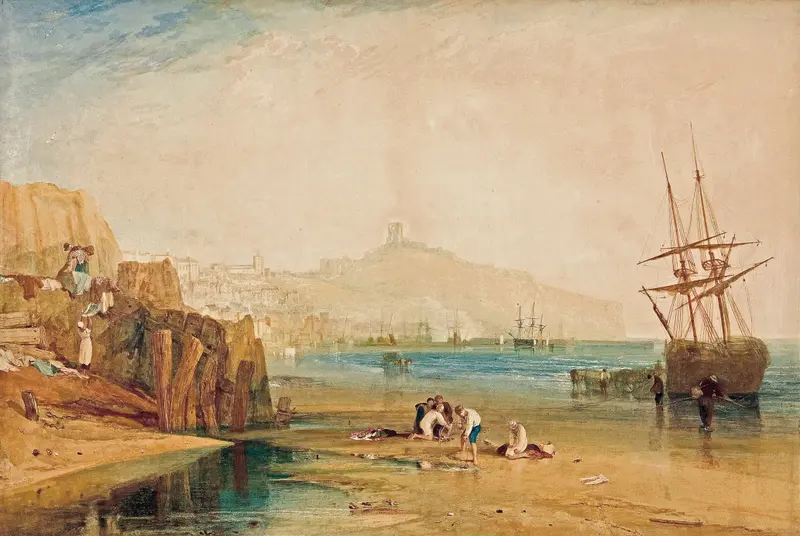 Boys crouch on wet sand near water’s edge catching crabs, with Scarborough town and castle visible in the misty background.