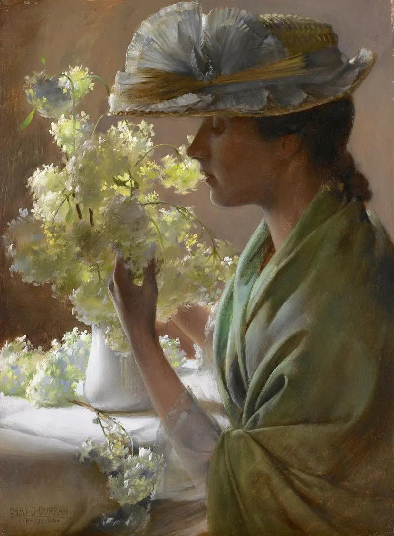 A portrait of a woman holding a bouquet of snowball flowers.