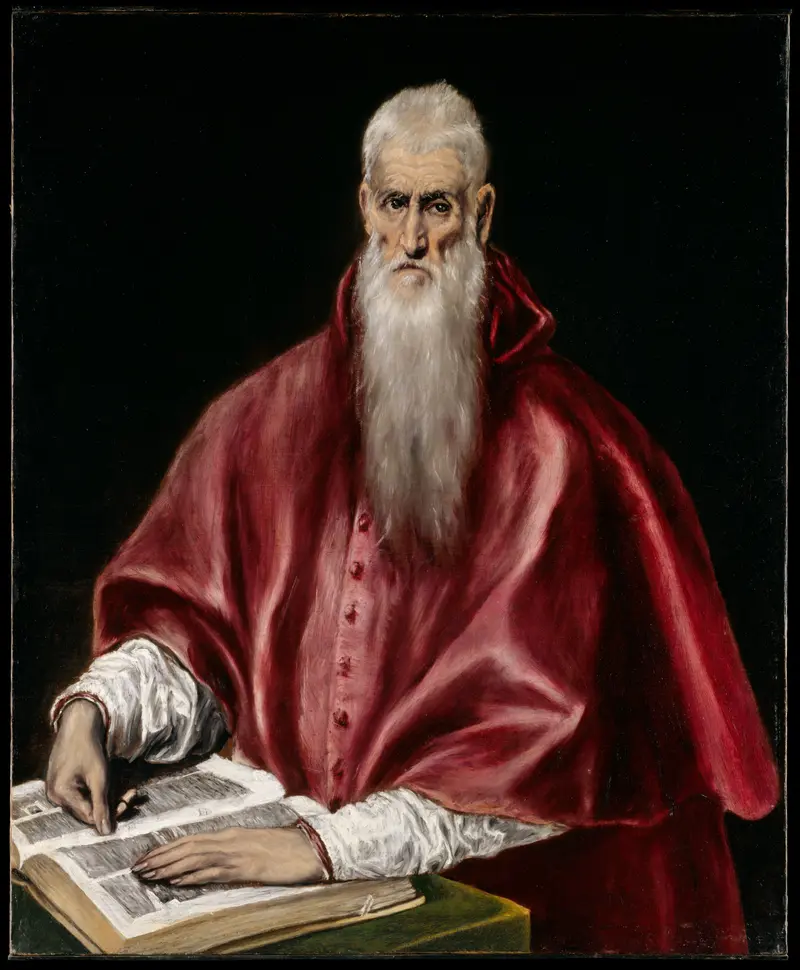 A white-bearded man in red robes sits at a table, pointing to an open book with a green cloth beneath it against a dark background.