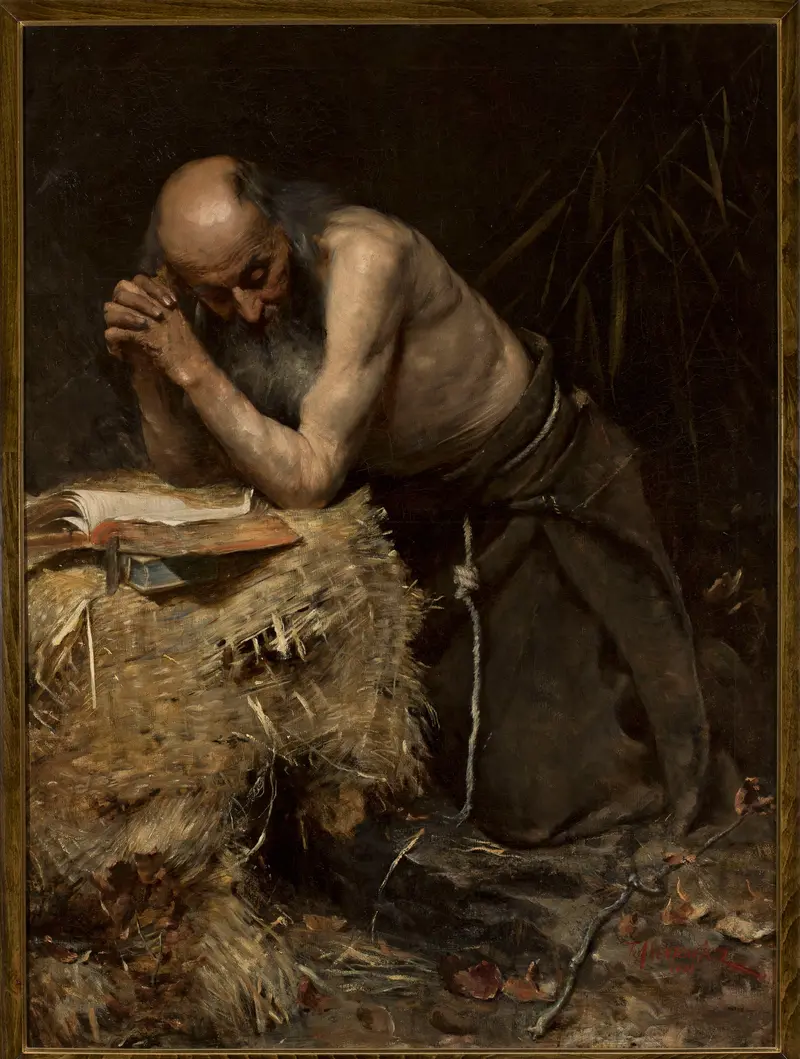 A contemplative portrait of a solitary figure in a dark setting.