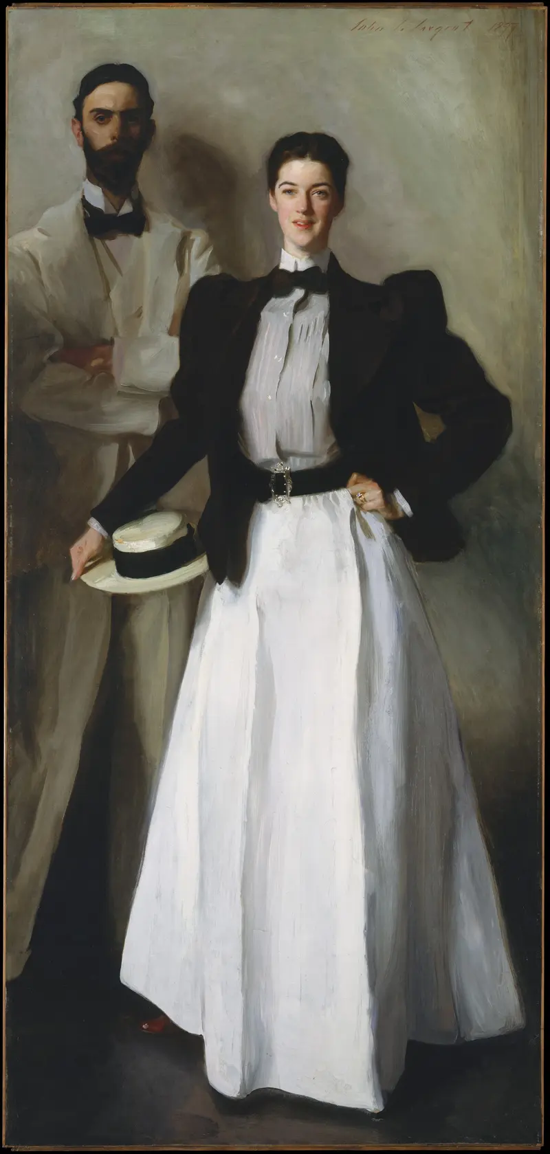 A woman in a white skirt and dark jacket stands confidently with a straw boater hat, while a man in a pale suit stands behind her in partial shadow.