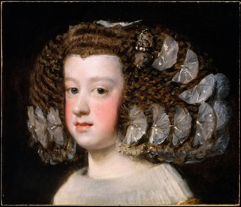 A young girl with pale skin and chestnut curls adorned with large silvery bows faces forward against a deep black background.