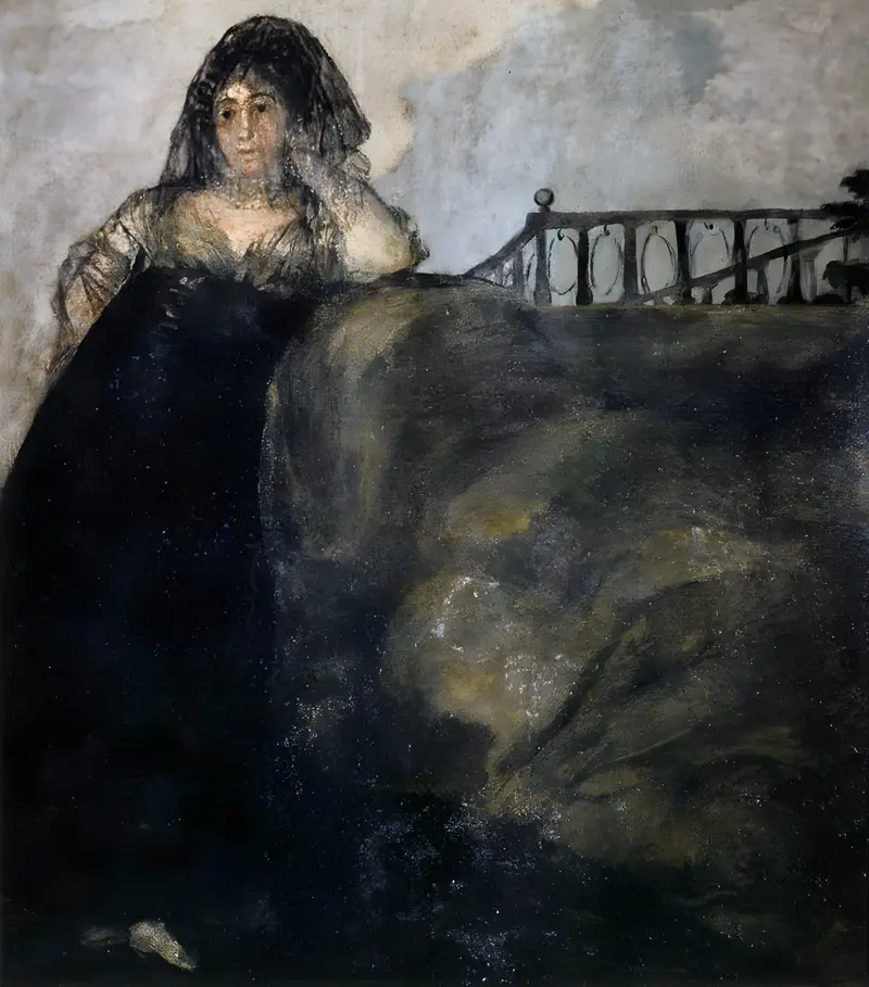 A solitary woman in a dark gown and veil leans against a large earthen mound beneath a wrought iron railing, gazing thoughtfully at the viewer.