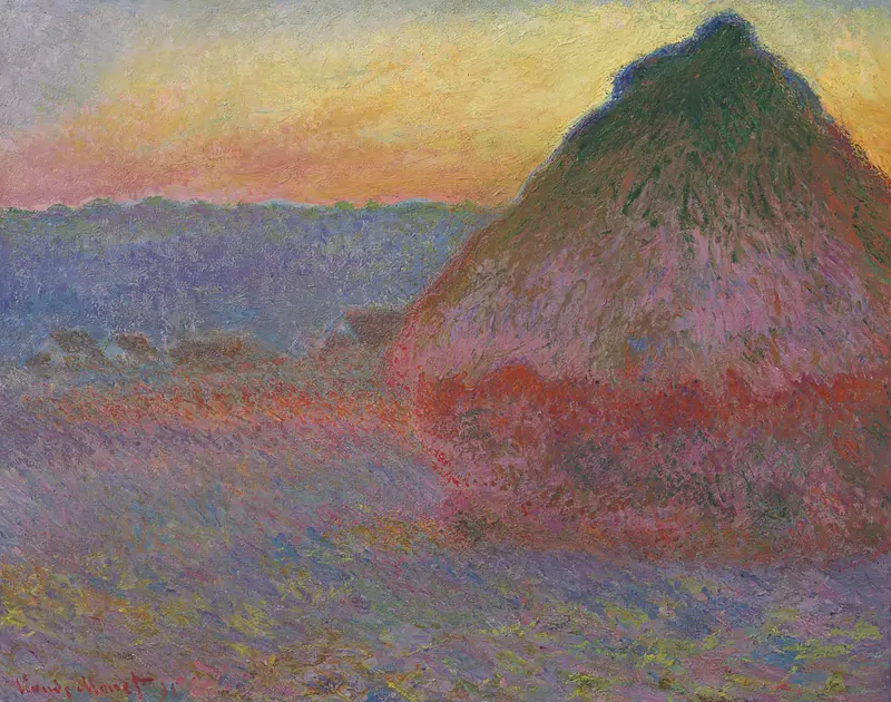 A single sunlit grainstack with warm orange, pink, and violet tones stands beside low buildings under a glowing sunset sky.