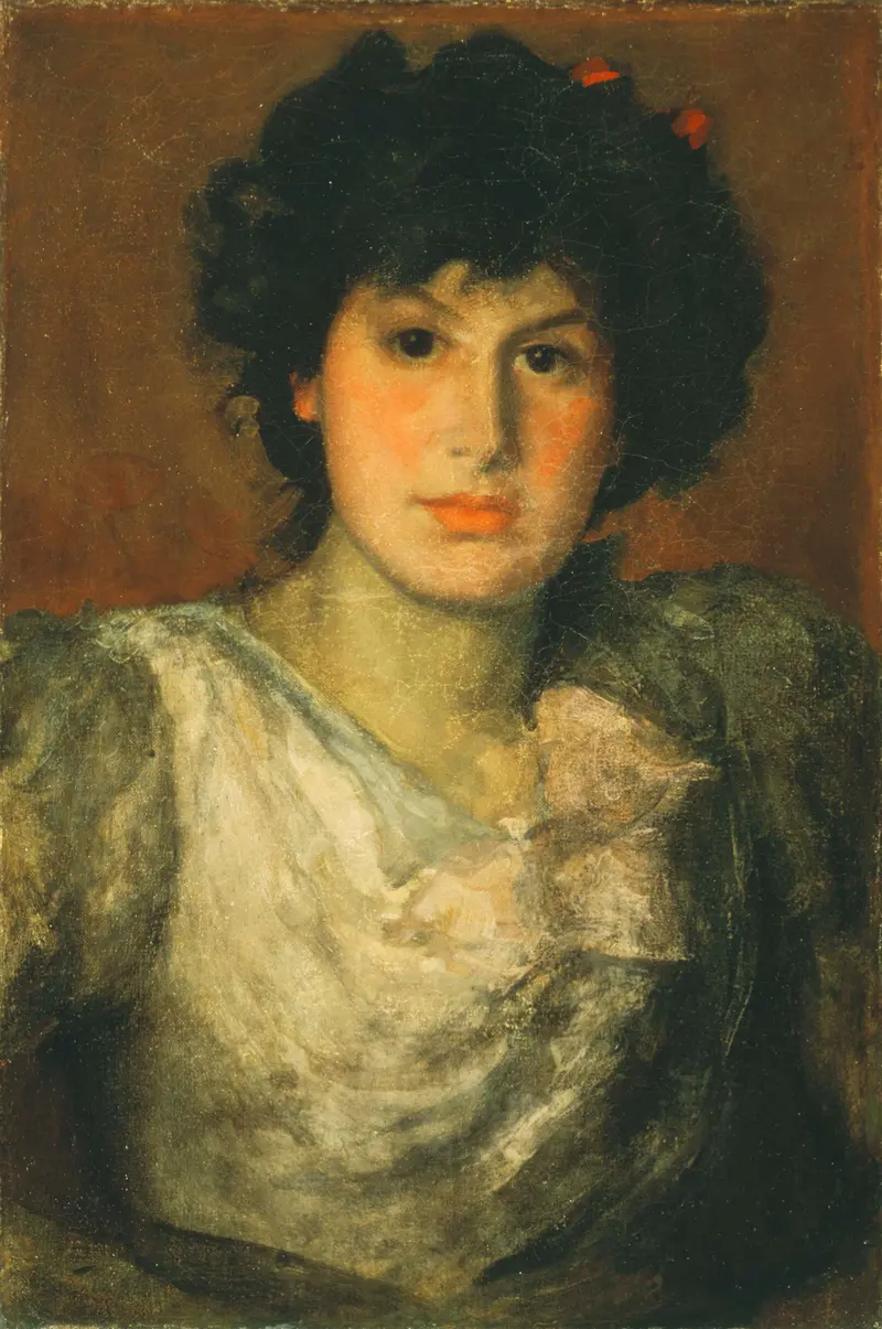 A portrait of a young woman with a direct gaze, soft features, and dark hair adorned with red ribbons.