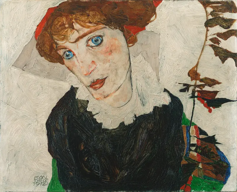 A young woman with blue eyes and a red headscarf gazes outward, wearing a white ruffled collar and dark garment against a textured neutral background.