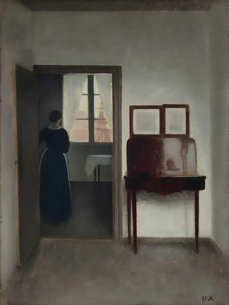 A woman sits in a quiet interior, surrounded by muted colors and soft light.