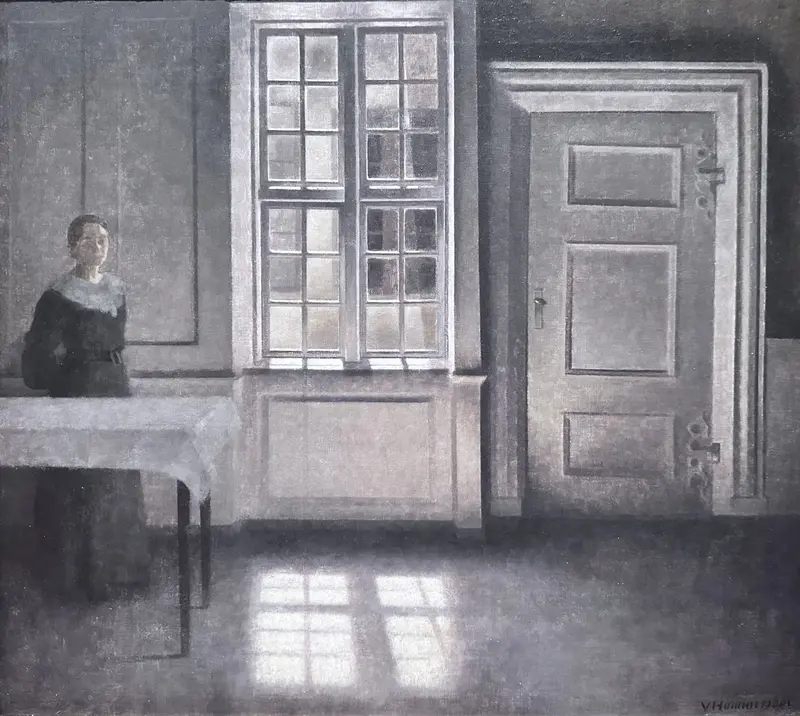 A serene interior scene bathed in sunlight, showcasing the work of Vilhelm Hammershøi.