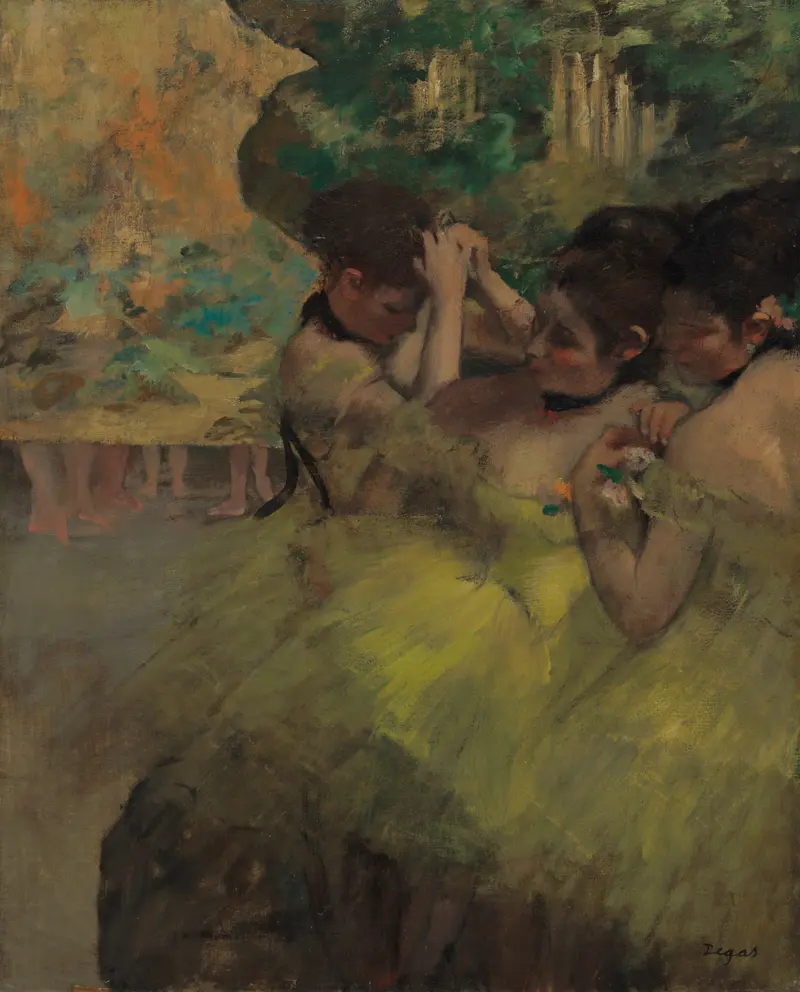 Three dancers in yellow tutus cluster at the right edge of the stage, adjusting their costumes and hair under soft stage lighting.
