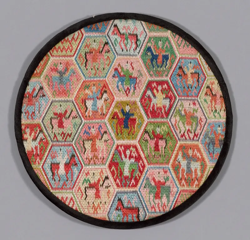 Lacquer mirror case by China featuring intricate embroidery and reflections.