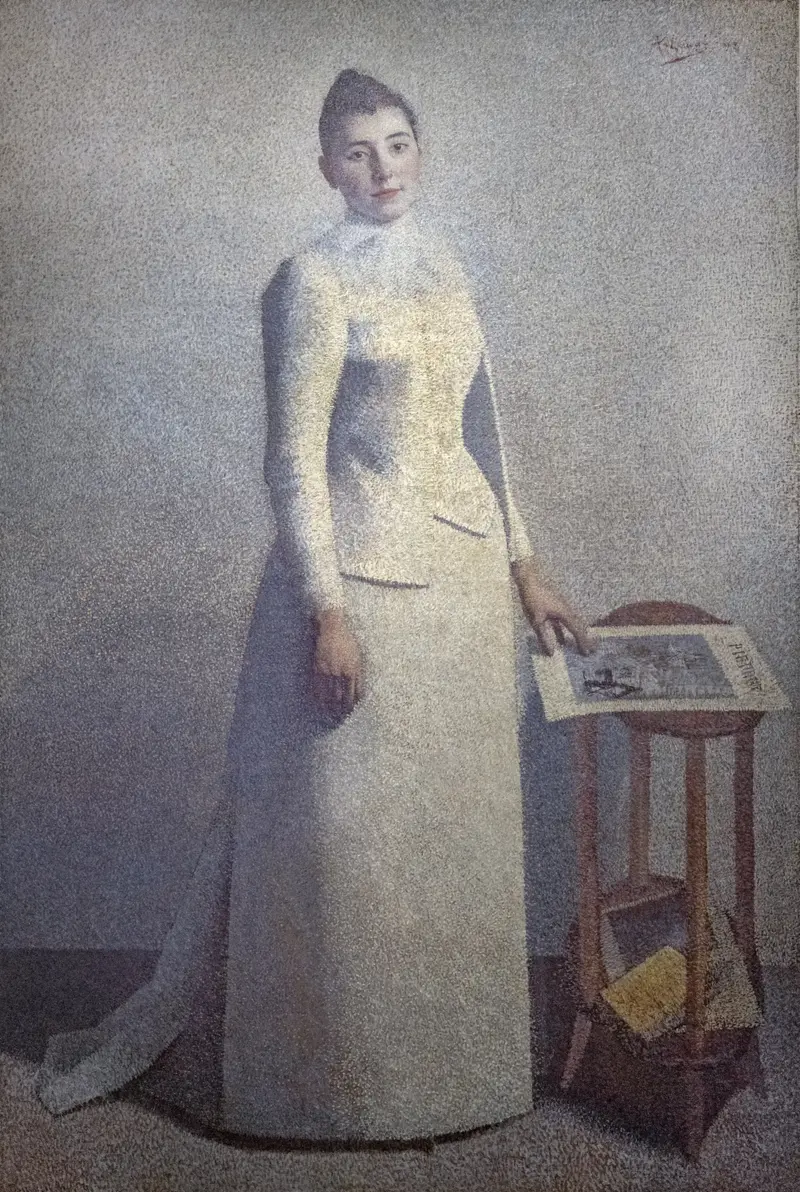 A woman in a white dress with a calm gaze, surrounded by soft colors and a table with books and a newspaper.