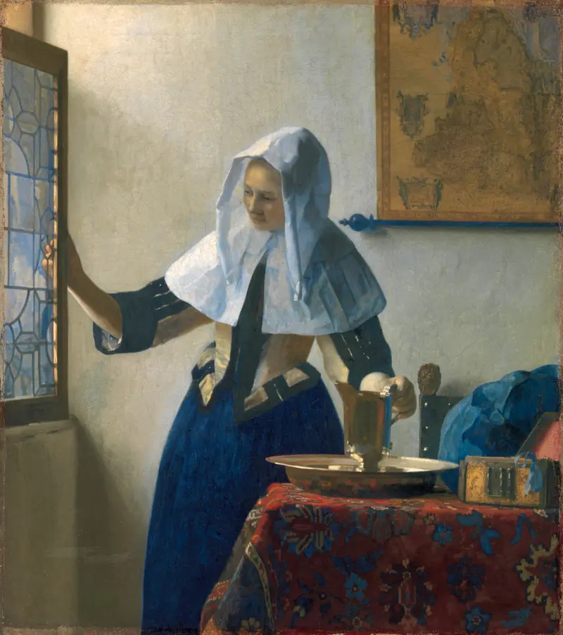 A young woman stands near a window, gently pushing open a leaded glass pane, with a blue skirt and white linen head covering, beside a table with a water jug and basin.