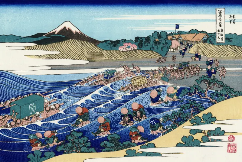Woodblock print by Katsushika Hokusai showing indigo waves and Mount Fuji under a pastel sky.