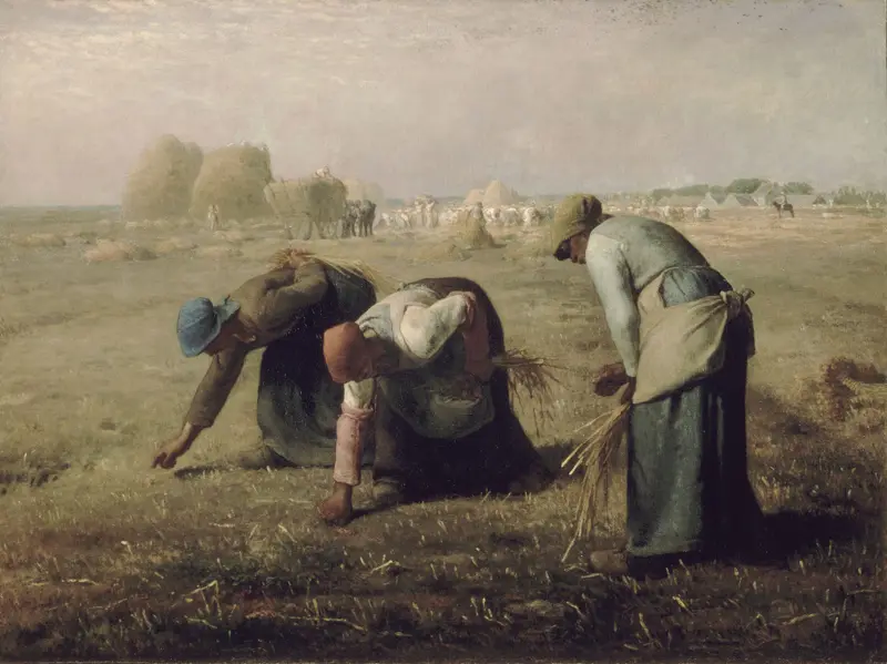 Three peasant women bend over a sunlit field gathering leftover stalks of wheat by hand, with haystacks, laborers, and carts in the background under a pale sky.