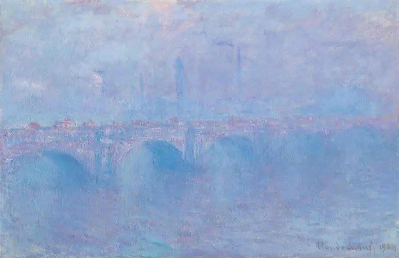 A foggy view of Waterloo Bridge with soft blue haze, faint city chimneys, and reflections on the water under a cloudy sky.