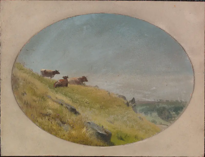Three cows pause mid-graze on a hillside under a muted, cloud-brushed sky.