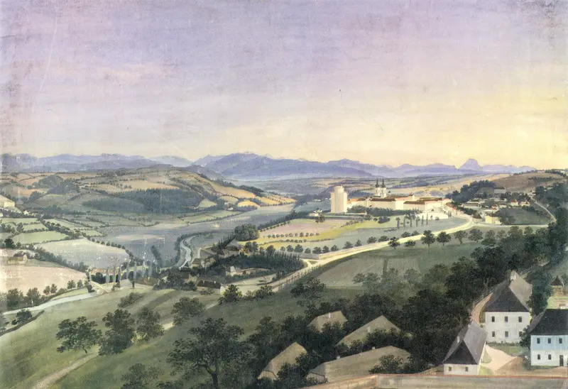 A serene landscape featuring Kremsmünster Abbey amidst fields and hills under a pale sky.