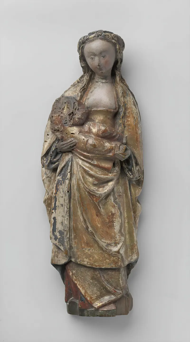 Virgin and Child, walnut sculpture by Unknown Artist, depicting a mother cradling her child.