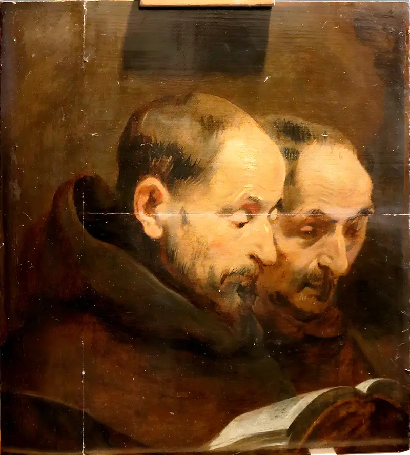 Two monks engaged in a quiet moment of contemplation.