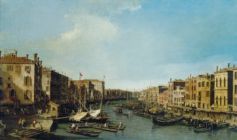 A detailed view of the Grand Canal in Venice, showcasing the Rialto Bridge and Palazzo Foscari.