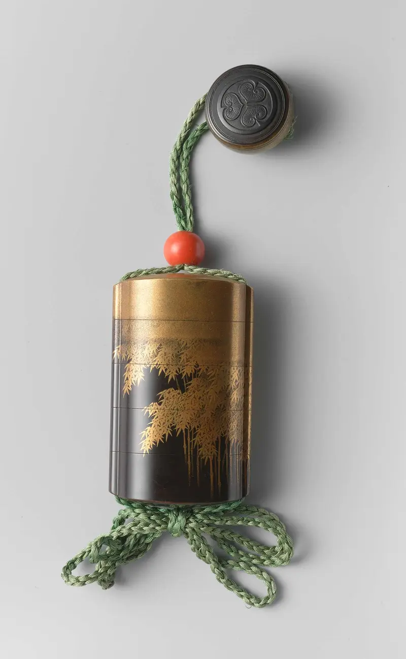 Inro by Shiomi Masanari, wood medium, showcasing intricate lacquer details.