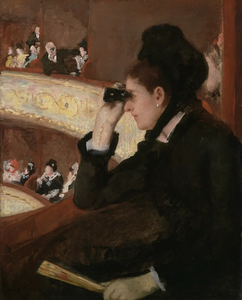 A woman dressed in black sits in a theater box raising opera glasses to her eyes, with a golden balcony rail and other theatergoers in the background.