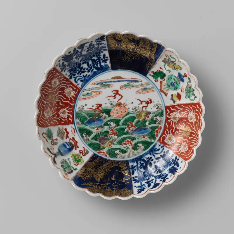 Ceramic saucer-dish with fluted sides, flowers, and shellfish above waves by Unknown Artist