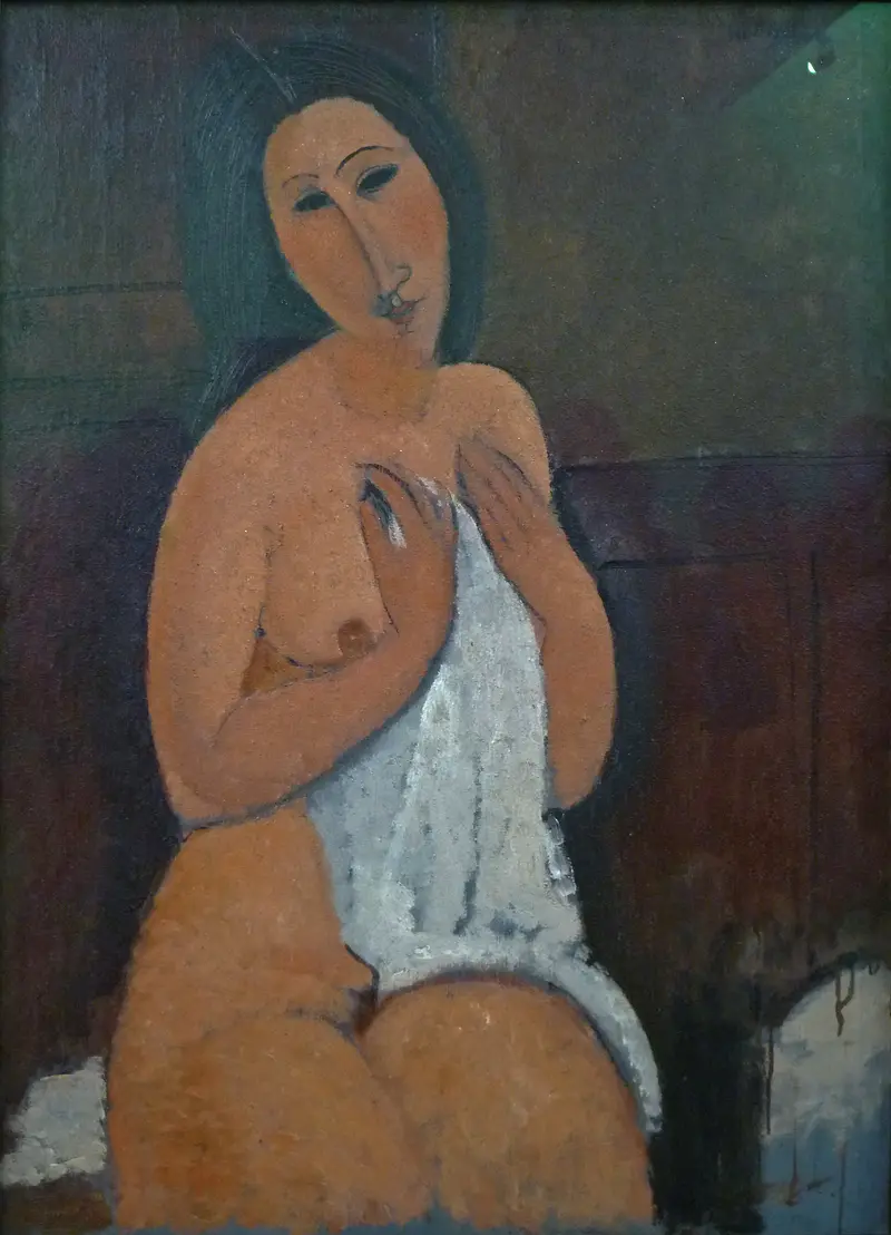 Amedeo Modigliani's Seated nude with shirt features a calm woman in an open shirt, embodying modern intimacy.
