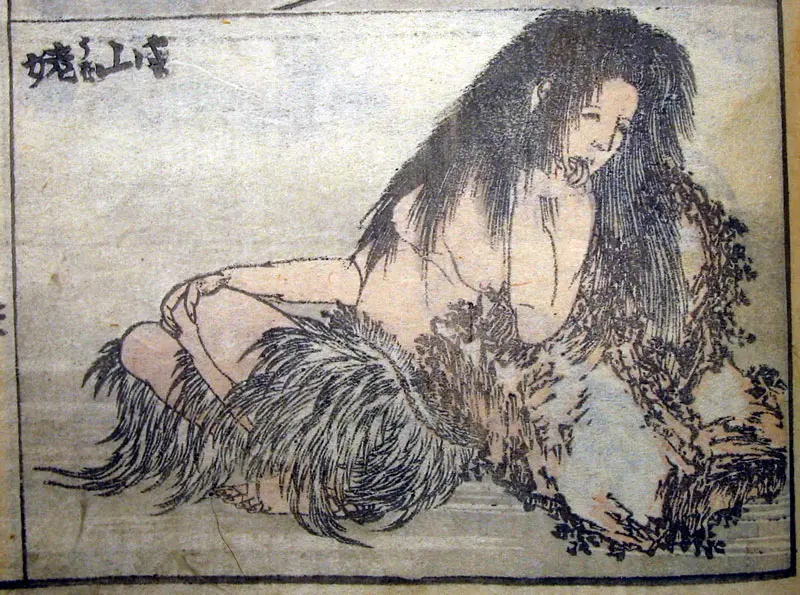 Yama-uba, the mountain witch, leans over the infant Kintaro in a scene depicting both menace and maternal tenderness.