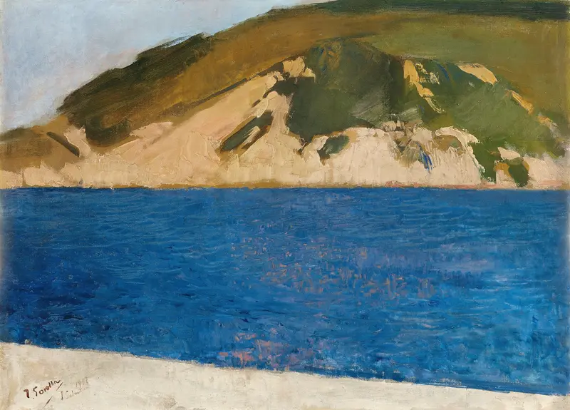 A landscape painting showing vivid blue water, a pale shore, ochre and green mountain slopes, and a pale blue sky with the artist's signature in the lower left corner.