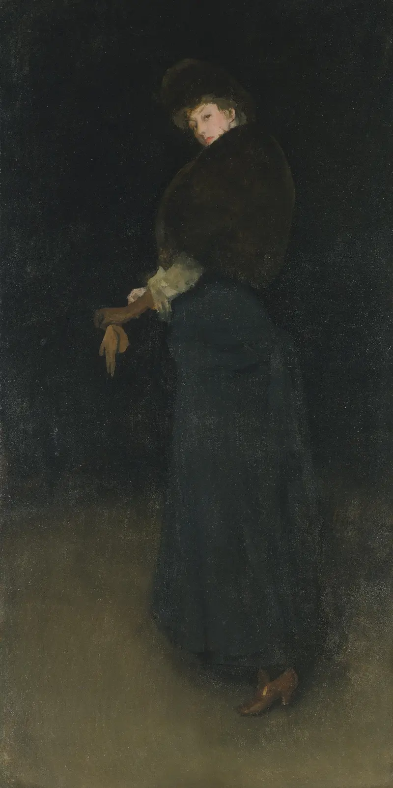 A woman in a dark setting, with bright yellow shoes and gloves, gazes at the viewer with a reserved pose.