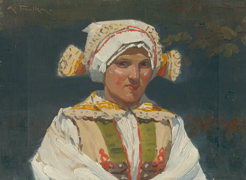 A woman in traditional Slovak attire gazes directly at the viewer, showcasing her festive dress and elaborate headscarf.