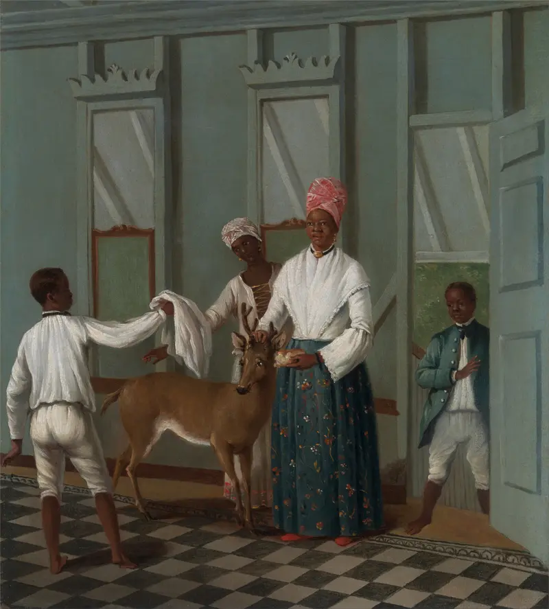 A deer stands in a sunlit interior as two women and a boy attend to it with care.