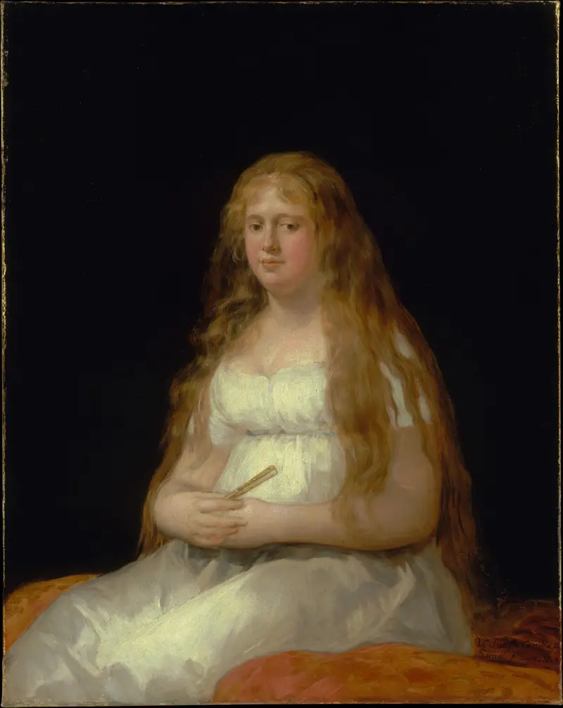 A young woman in a white dress sits against a black background, holding a closed fan on her lap with a calm expression.