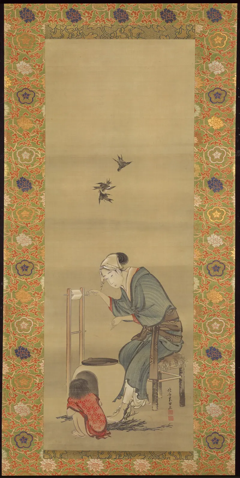 A woman focused on spinning silk, capturing a moment of domestic labor.