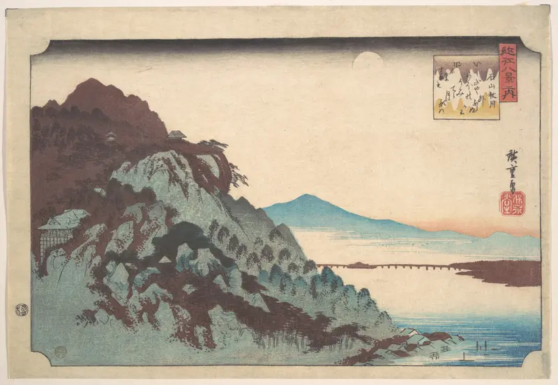 A pale full moon above a misty lake beside a rugged hillside dotted with trees, buildings, and a distant bridge under a blue mountain.