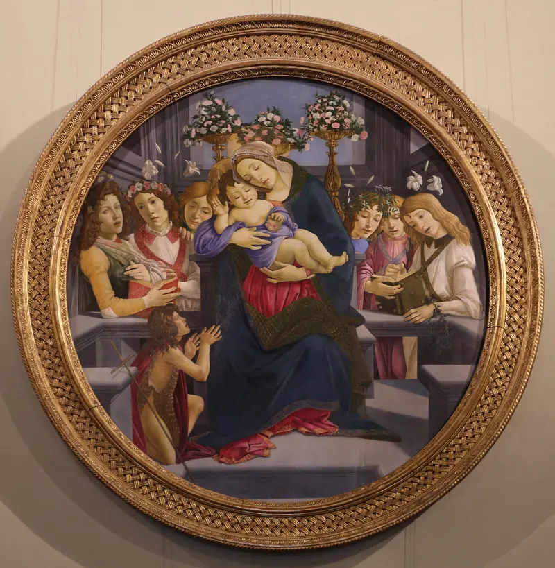 Madonna and Child with six angels and Saint John the Baptist as Child by Sandro Botticelli.