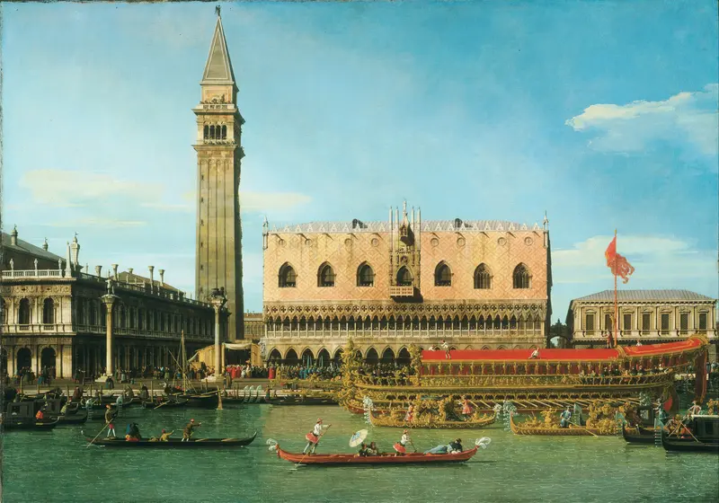 A richly ornamented state barge glides across turquoise waters near the Doge's Palace and a crowd at the waterfront in Venice.