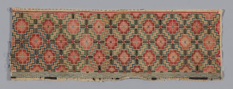 Decorative silk sleeveband by Han-Chinese with intricate blue and gold embroidery.